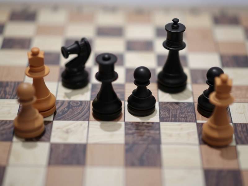 Checkers board game setup with pieces