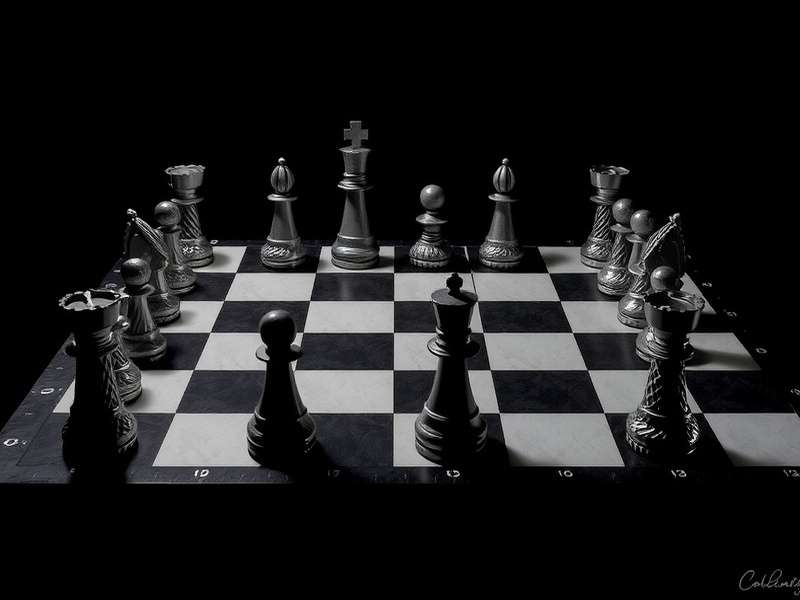 Checkers game board setup with red and black pieces